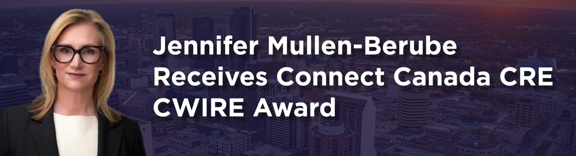 A photo of the downtown Winnipeg skyline with an indigo overlay. The text on the photo reads "Jennifer Mullen-Berube Receives Connect Canada CRE CWIRE Award". Jennifer's headshot is on the left hand side of the image.